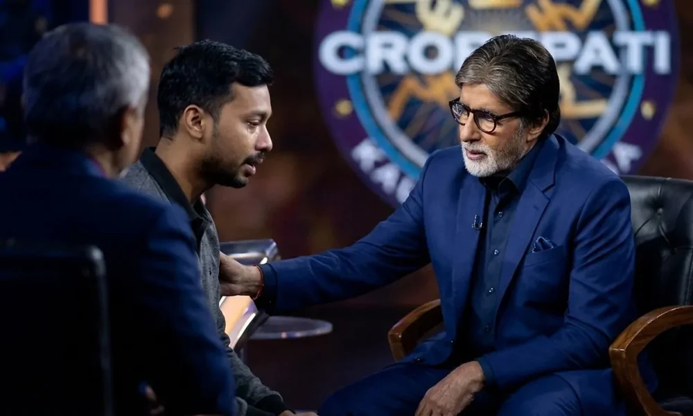 Amitabh Bachchan listens to an emotional contestant on KBC 18
